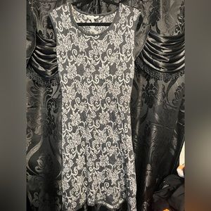 Sleeveless gray and silver dress.